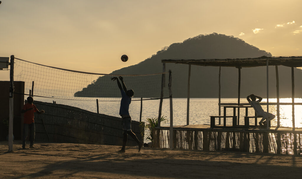 playing volley next to lake malawi