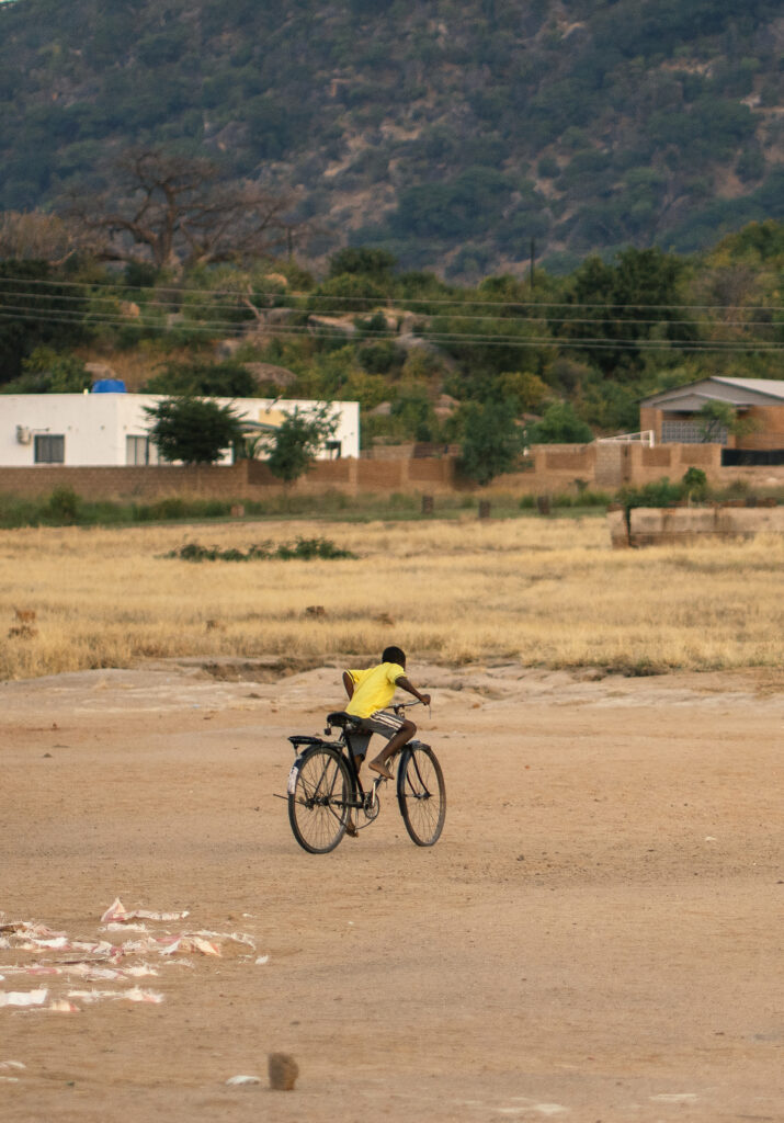 african boy riding a big bike 
