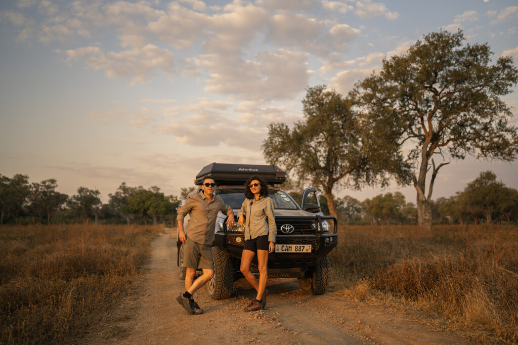 safari couple at sunset