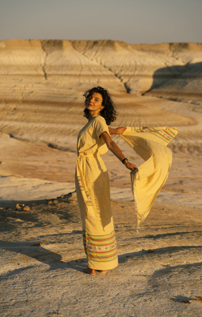girl wearing yellow in desert 