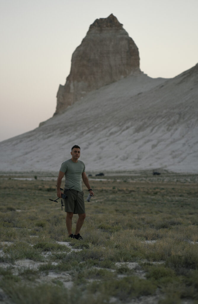 a man and a drone in martial landscape 