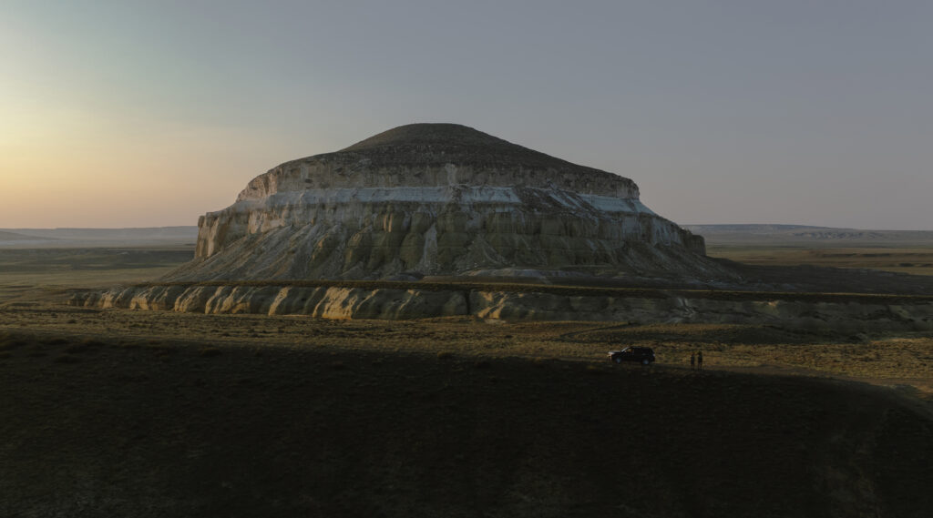 a couple and a car near mount sherkala 